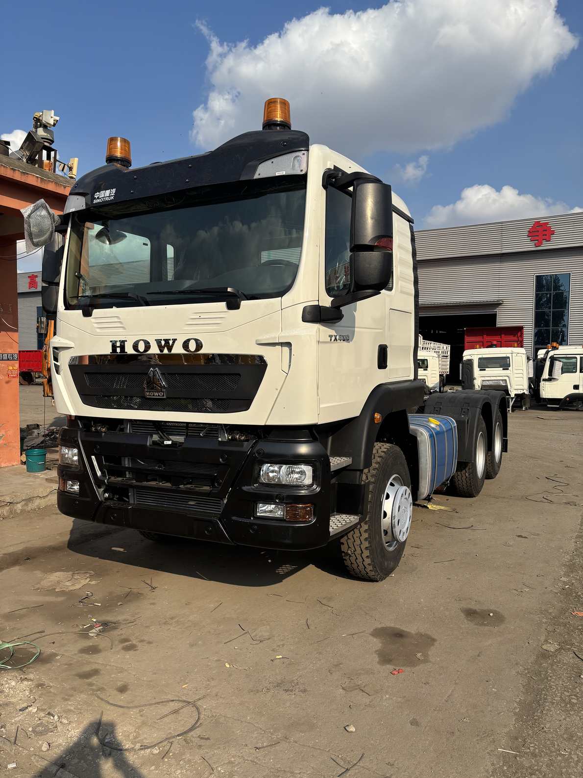 HOWO 6x4 tractor head, front view, in our Jining yard
